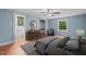 Spacious main bedroom with a ceiling fan, dresser, and ensuite bathroom at 323 Coral Ave, Goldston, NC 27252