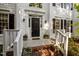 A welcoming front porch, with planters, leads to the elegant front door of this home at 3514 Shady Creek Dr, Durham, NC 27713