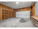 Attached garage features a workbench, lots of shelving and a two-car garage door at 3514 Shady Creek Dr, Durham, NC 27713