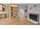 Inviting living room showcases hardwood floors, a cozy fireplace, and built-in shelving for decor at 3514 Shady Creek Dr, Durham, NC 27713