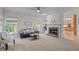 Inviting living room with a brick fireplace, built-in shelves, and ample natural light at 3514 Shady Creek Dr, Durham, NC 27713