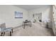 Comfortable living room featuring neutral carpet, a desk, and a cozy seating area at 3514 Shady Creek Dr, Durham, NC 27713
