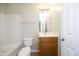 Bathroom with wood vanity, toilet, and tub with shower combo at 3623 Bison Hill Ln, Raleigh, NC 27604