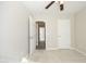 Bedroom with carpet, ceiling fan, and open doorway showing wood floors in the hall at 3623 Bison Hill Ln, Raleigh, NC 27604