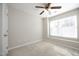 Bedroom featuring a carpet, ceiling fan, and a window letting in natural light at 3623 Bison Hill Ln, Raleigh, NC 27604