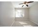 Bedroom with neutral carpet, ceiling fan, and a window bringing in natural light at 3623 Bison Hill Ln, Raleigh, NC 27604