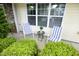 Inviting front porch with striped chairs and garden view at 3623 Bison Hill Ln, Raleigh, NC 27604