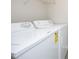 New washer and dryer in well lit laundry room with white walls at 3623 Bison Hill Ln, Raleigh, NC 27604
