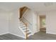 Bright and airy staircase with hardwood banister and luxury vinyl flooring at 3623 Bison Hill Ln, Raleigh, NC 27604