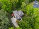 A bird's eye view of the home displaying a backyard deck and long driveway at 40 Holden Ct, Youngsville, NC 27596