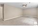 Large bedroom with neutral walls, carpet, ceiling fan and ample space for furniture at 40 Holden Ct, Youngsville, NC 27596