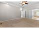 Expansive bedroom with neutral colors, carpet, and doors leading to other rooms at 40 Holden Ct, Youngsville, NC 27596
