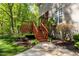 Wood deck with stairs and manicured landscaping against the home's exterior at 40 Holden Ct, Youngsville, NC 27596
