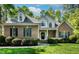 Beautiful brick home with dormer windows, black shutters, and a welcoming front porch at 40 Holden Ct, Youngsville, NC 27596