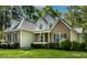 A lovely two-story home featuring a brick and siding exterior with green shutters at 40 Holden Ct, Youngsville, NC 27596