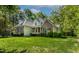 A charming two-story brick and siding house with mature landscaping at 40 Holden Ct, Youngsville, NC 27596