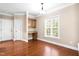 Inviting office space with built-in desk and cabinets, ample natural light and hardwood flooring at 40 Holden Ct, Youngsville, NC 27596