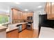 Stylish kitchen boasting stainless steel appliances, light cabinets and hardwood floors at 40 Holden Ct, Youngsville, NC 27596
