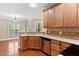 Bright eat-in kitchen with stainless appliances, light wood cabinets, and seamless flow to adjacent rooms at 40 Holden Ct, Youngsville, NC 27596