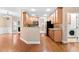 Open concept kitchen featuring light wood cabinets, stainless steel appliances and hardwood floors at 40 Holden Ct, Youngsville, NC 27596