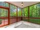 Relax on this screened-in porch with wood flooring and enjoy the beautiful nature views at 40 Holden Ct, Youngsville, NC 27596