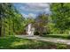 This shot showcases a 2-car garage, a deck, and tasteful landscaping at 40 Holden Ct, Youngsville, NC 27596