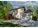 Rear view showing a home's two-car garage and wood deck at 40 Holden Ct, Youngsville, NC 27596