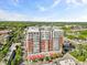 Exterior shot of a high-rise condo building with multiple balconies and red awnings at 400 W North St # 502, Raleigh, NC 27603