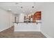 Open kitchen view from living area featuring stainless appliances and modern lighting at 400 W North St # 502, Raleigh, NC 27603