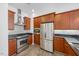 Updated kitchen featuring stainless steel appliances, granite countertops, and mosaic backsplash at 400 W North St # 502, Raleigh, NC 27603