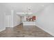Open concept space boasts recessed lights and wood-look tile flooring at 400 W North St # 502, Raleigh, NC 27603