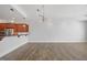 Bright, open living space featuring hardwood floors, recessed lighting, and a modern light fixture at 400 W North St # 502, Raleigh, NC 27603