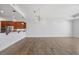 Spacious living room with bar area, modern lighting, and hardwood floors at 400 W North St # 502, Raleigh, NC 27603