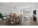 Open living space with dining area, neutral decor, and large windows for natural light at 400 W North St # 502, Raleigh, NC 27603