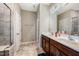 Bathroom with double sink vanity and walk-in shower at 403 Lagoon Ln, Mebane, NC 27302