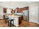 Well-appointed kitchen with a spacious island, stainless steel appliances, and ample cabinet space at 403 Lagoon Ln, Mebane, NC 27302