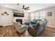 Cozy living room featuring comfortable seating, a fireplace with a TV mounted above, and ample natural light at 403 Lagoon Ln, Mebane, NC 27302