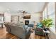 Bright living room features a fireplace, ceiling fan, and large windows at 403 Lagoon Ln, Mebane, NC 27302
