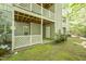 Backyard patio area offering privacy with white latticework and lush landscaping at 407 Gooseneck Dr # A2, Cary, NC 27513