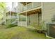 Backyard patio area offering privacy with white latticework and lush landscaping at 407 Gooseneck Dr # A2, Cary, NC 27513