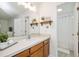 Bathroom featuring a white sink vanity with wood cabinets and a walk-in shower at 407 Gooseneck Dr # A2, Cary, NC 27513