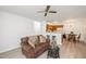 Comfortable living room with a ceiling fan and open layout to the kitchen and dining area at 407 Gooseneck Dr # A2, Cary, NC 27513