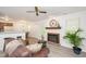 Inviting living room featuring a cozy fireplace, ceiling fan, and wood-look flooring at 407 Gooseneck Dr # A2, Cary, NC 27513