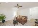 Cozy living room space featuring a ceiling fan and warm, inviting decor at 407 Gooseneck Dr # A2, Cary, NC 27513