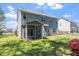 Charming two-story home features a well-maintained lawn and a screened porch, perfect for outdoor living at 421 Long Lake Dr, Fuquay Varina, NC 27526