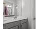 A well-lit bathroom features a modern vanity with sleek fixtures and ample counter space at 421 Long Lake Dr, Fuquay Varina, NC 27526