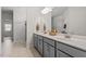 Bright bathroom features double vanity with modern fixtures and plenty of counter space at 421 Long Lake Dr, Fuquay Varina, NC 27526