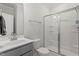 Modern bathroom features a glass shower, ample counter space, vanity, and contemporary fixtures at 421 Long Lake Dr, Fuquay Varina, NC 27526