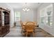 Dining room featuring a wood table, matching chairs, and ample natural light at 421 Long Lake Dr, Fuquay Varina, NC 27526