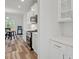 Bright kitchen features white cabinets, stainless steel appliances, and an adjacent eat-in dining area at 421 Long Lake Dr, Fuquay Varina, NC 27526